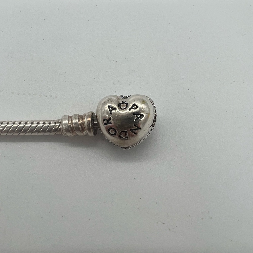 Pandora Bracelet Authentic, 9in long with sparkling heart clasp.
